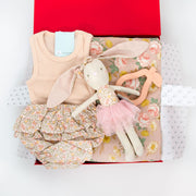This pretty hamper for the warmer weather ahead is the perfect combination of cute and practical. It features the sweetest selection of gifts for a new little miss including ruffle floral bloomers and organic, cotton tank top.  For swaddling a soft muslin wrap has been included and for play the adorable Pearl Bunny.  The handy pear silicone teether is a must have for the nappy bag and is the idea size for teething bubs. All items are beautifully presented in our chic, red, signature memory box. $165.00