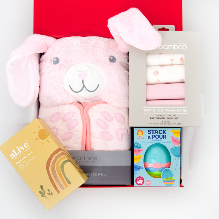 Bunny Parade Bathtime is a cute and very useful gift. The soft, plush hooded towel, 6 pack of muslin washers and classic stack & pour bath egg will delight at bath time, whilst the al.ive hair & body wash will make sure little one is squeaky clean.  This hamper is a suitable gift from newborn up to age 3. All gifts are beautifully presented in our chic, red, signature memory box. $125.00