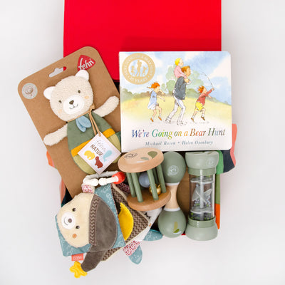 This thoughtful hamper features a selection of Eco friendly toys that stimulate little ones senses, coordination and motor strength. includes a board book, bell rattle, rainmaker, maraca, soft clothbook, crinkle bear. $145.00