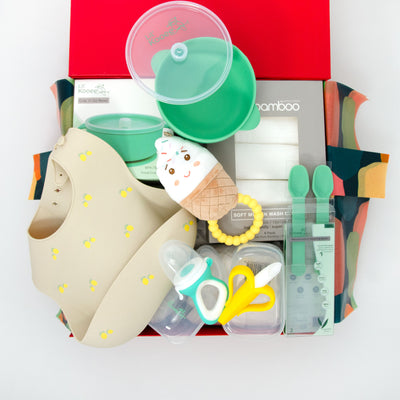 selection of gifts for a baby for mealtime including spoons,bowl,bib,teether,fresh food feeder, muslin clothes and a rattle. $145.00